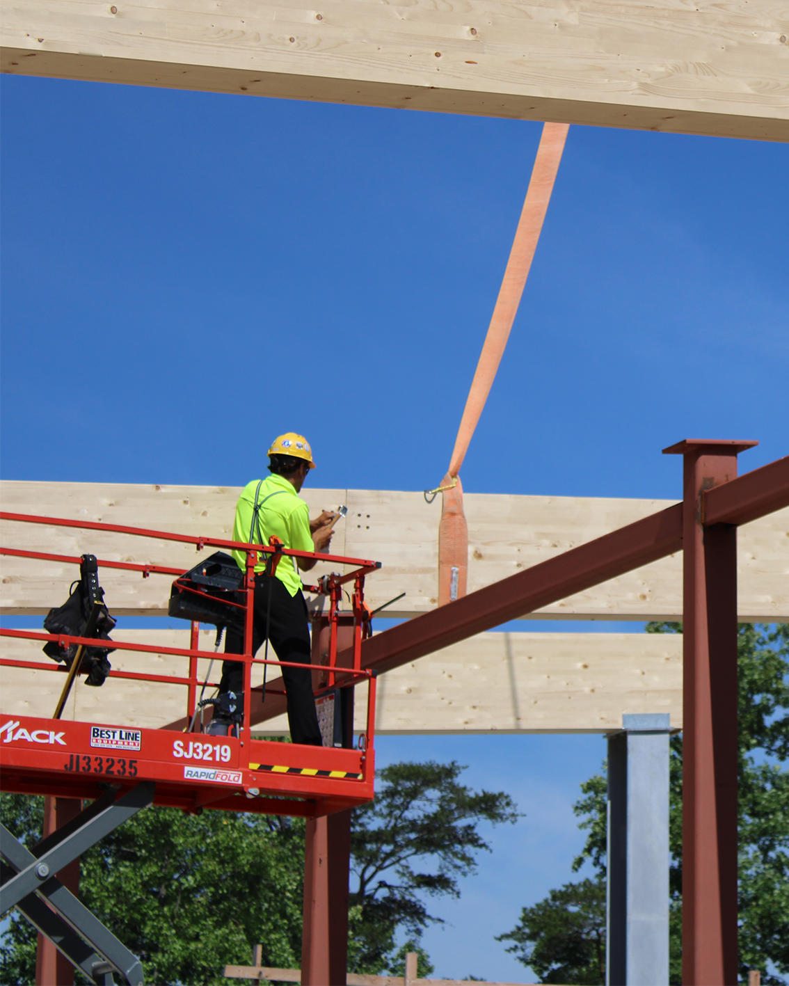 QB crew installing CLT panels with precision rigging and connection detail